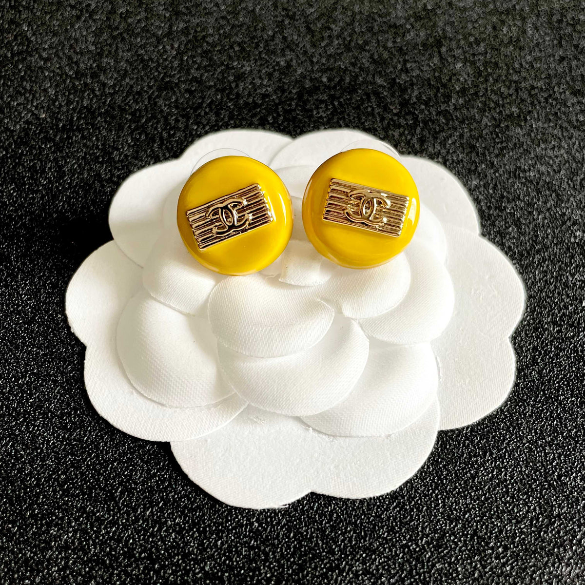 Martin Graham stud earrings in polished metal-tone – front product view