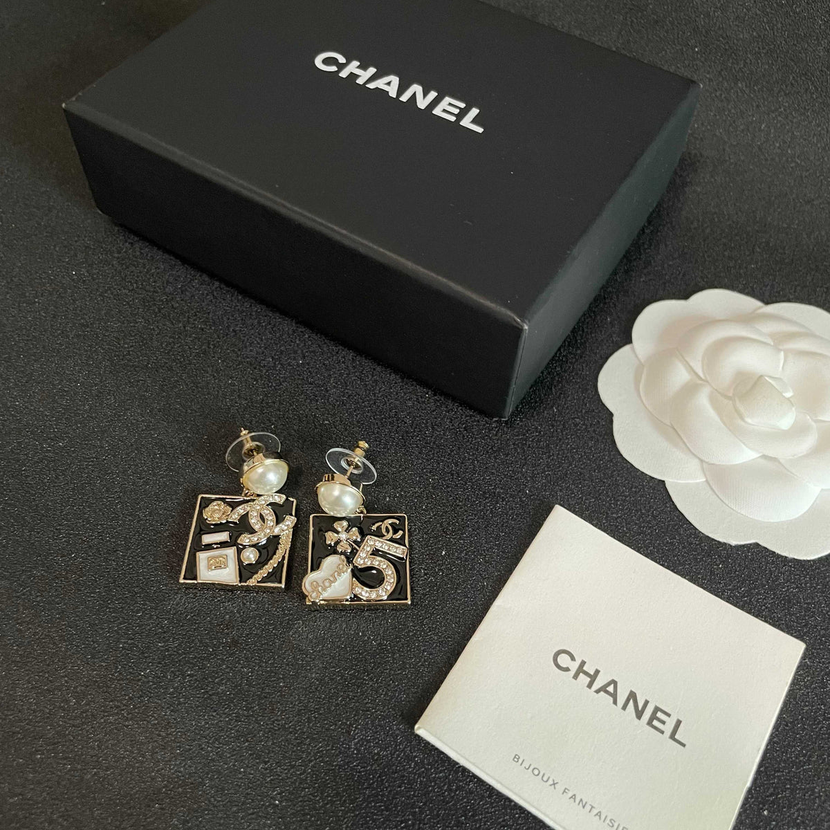 Martin Graham earrings in polished metal-tone – close-up detail
