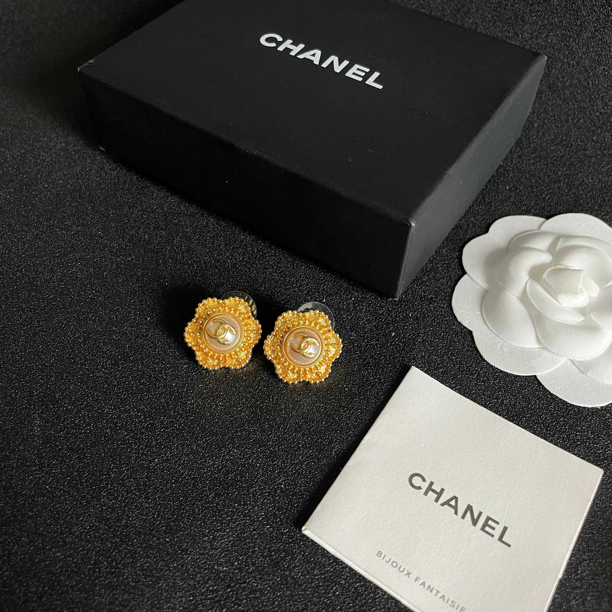 Martin Graham stud earrings in polished metal-tone – close-up detail