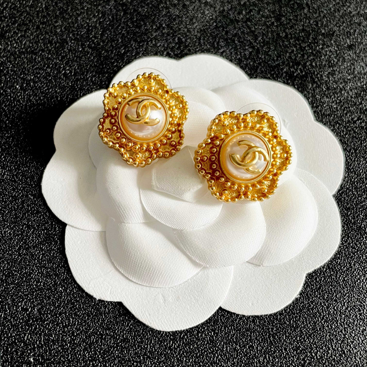 Martin Graham stud earrings in polished metal-tone – front product view