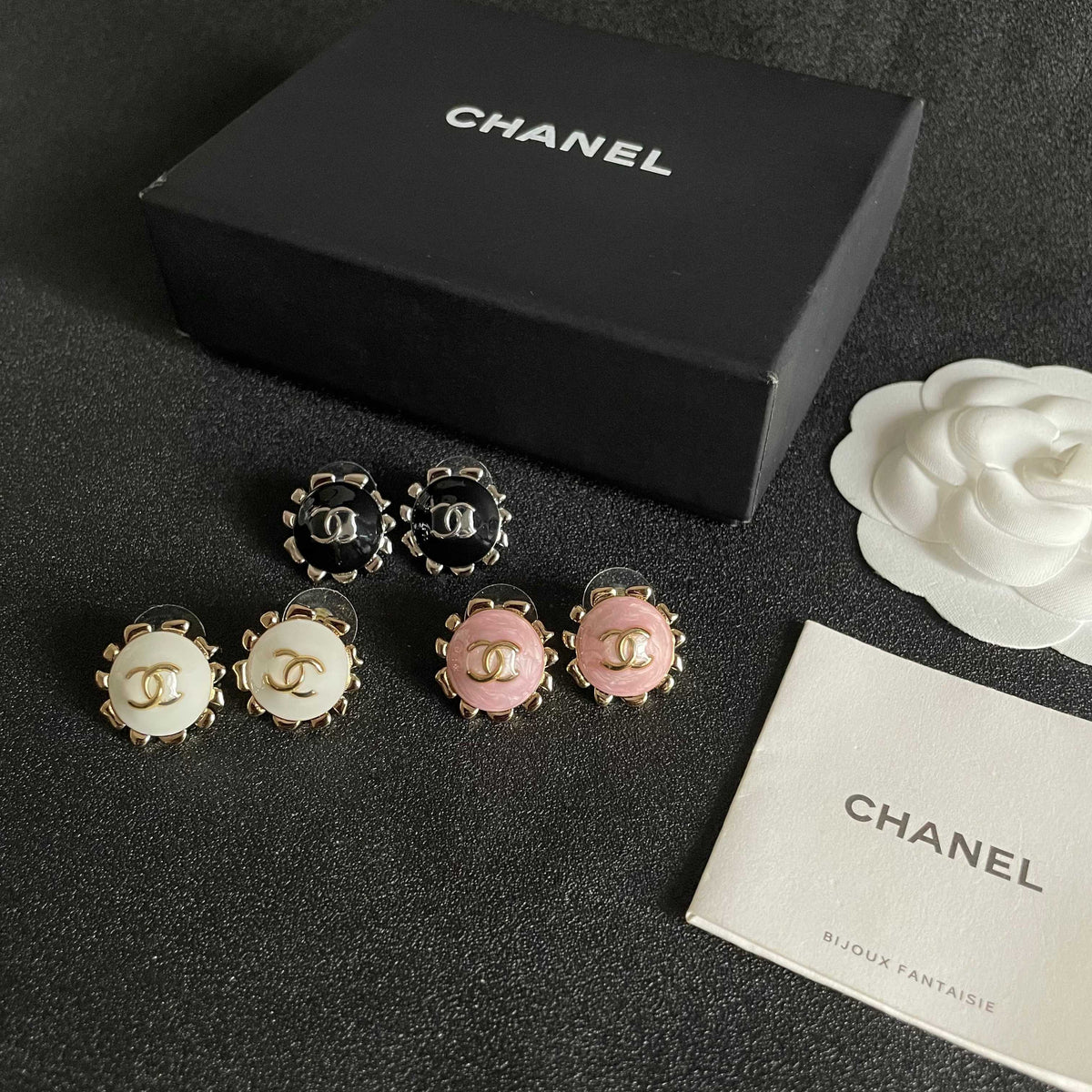 Martin Graham stud earrings in polished metal-tone – close-up detail