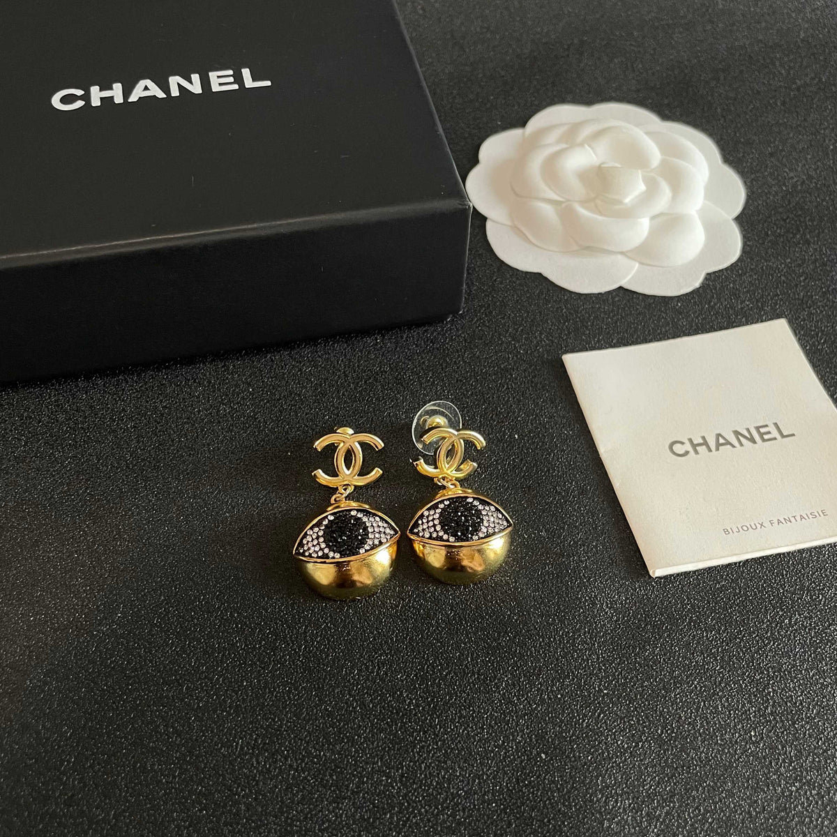 Martin Graham earrings in polished metal-tone – close-up detail