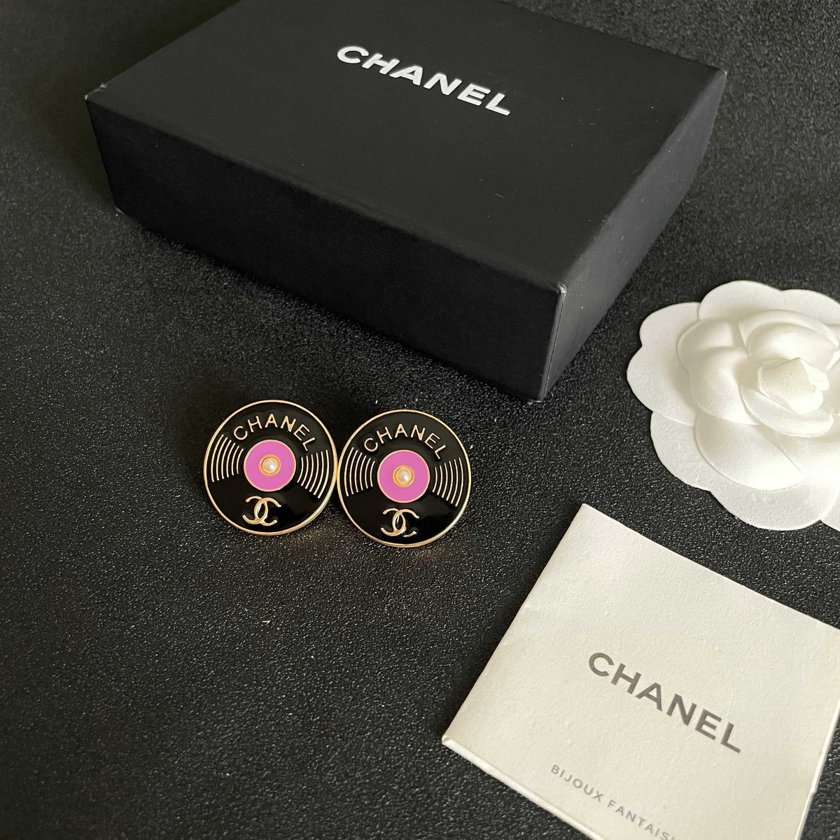 Martin Graham stud earrings in polished metal-tone – close-up detail