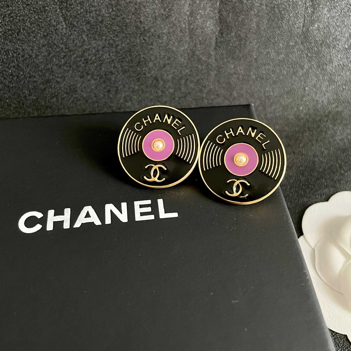 Martin Graham stud earrings in polished metal-tone – detail view