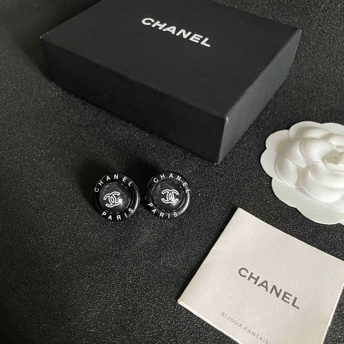 Martin Graham stud earrings in polished metal-tone – close-up detail