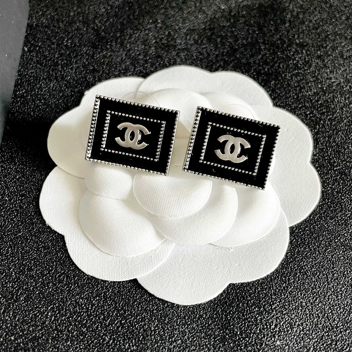 Martin Graham stud earrings in polished metal-tone – front product view