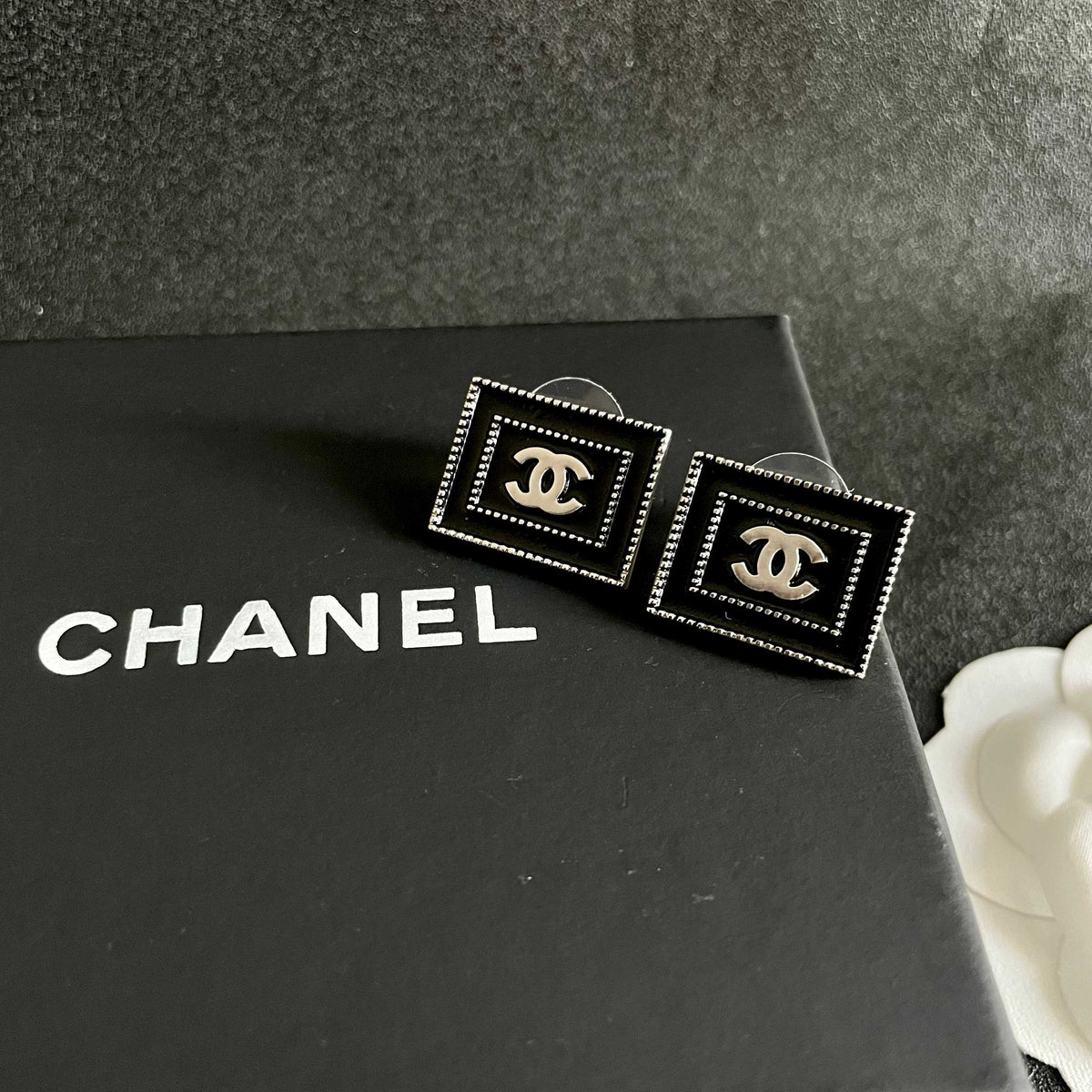 Martin Graham stud earrings in polished metal-tone – detail view