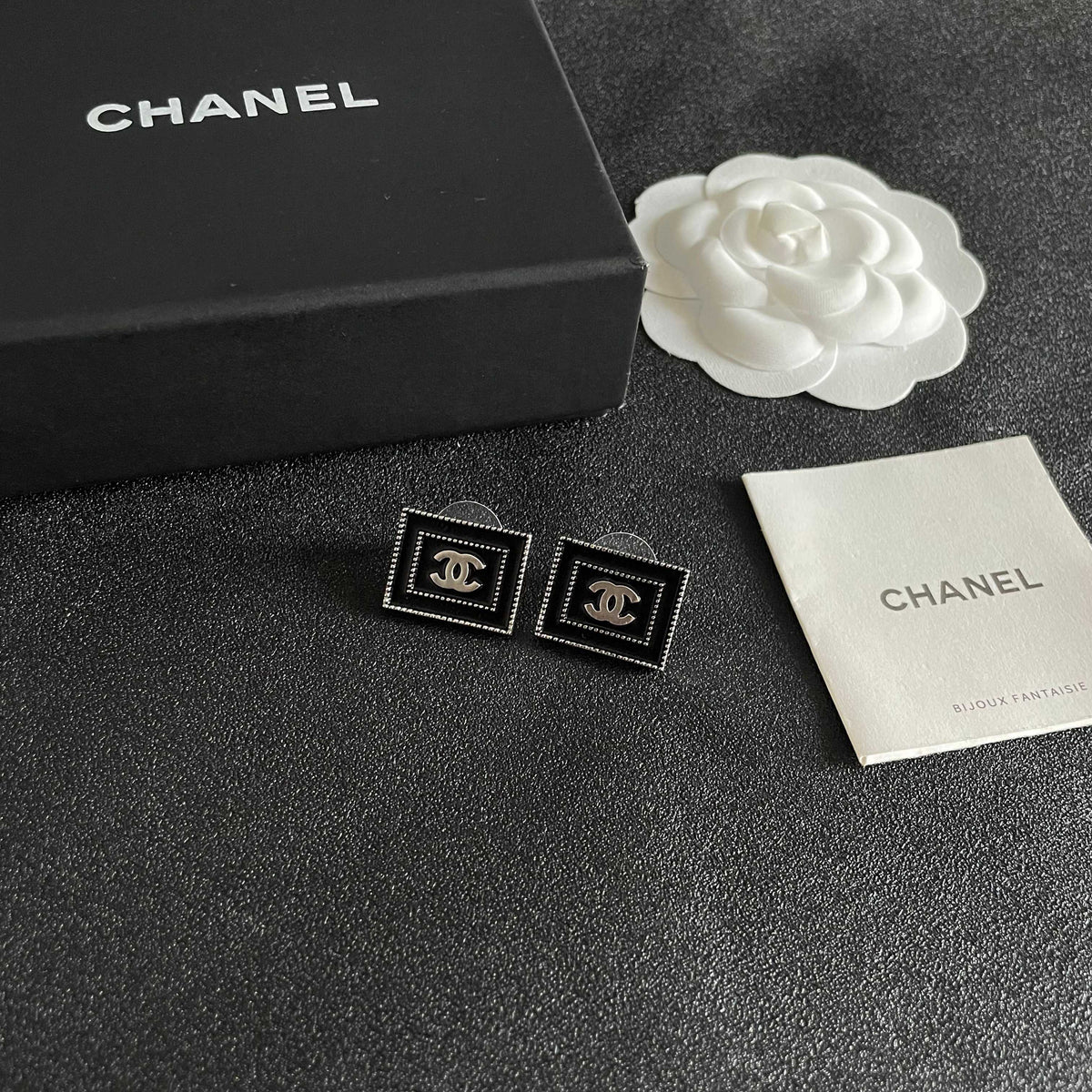 Martin Graham stud earrings in polished metal-tone – styled product view