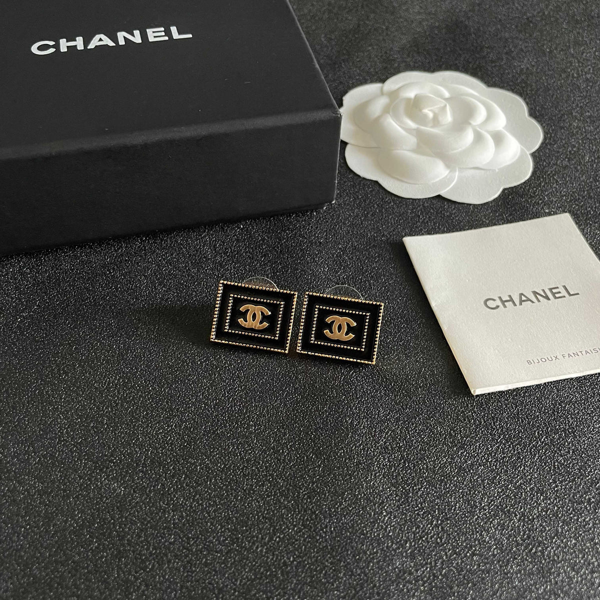 Martin Graham stud earrings in polished metal-tone – styled product view