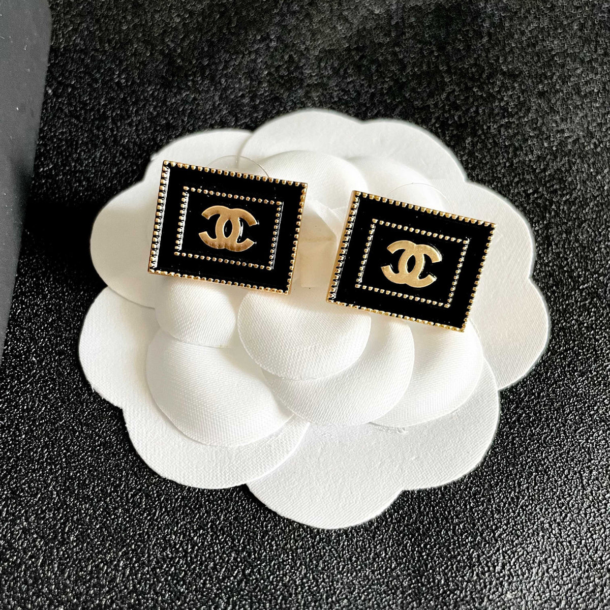 Martin Graham stud earrings in polished metal-tone – front product view
