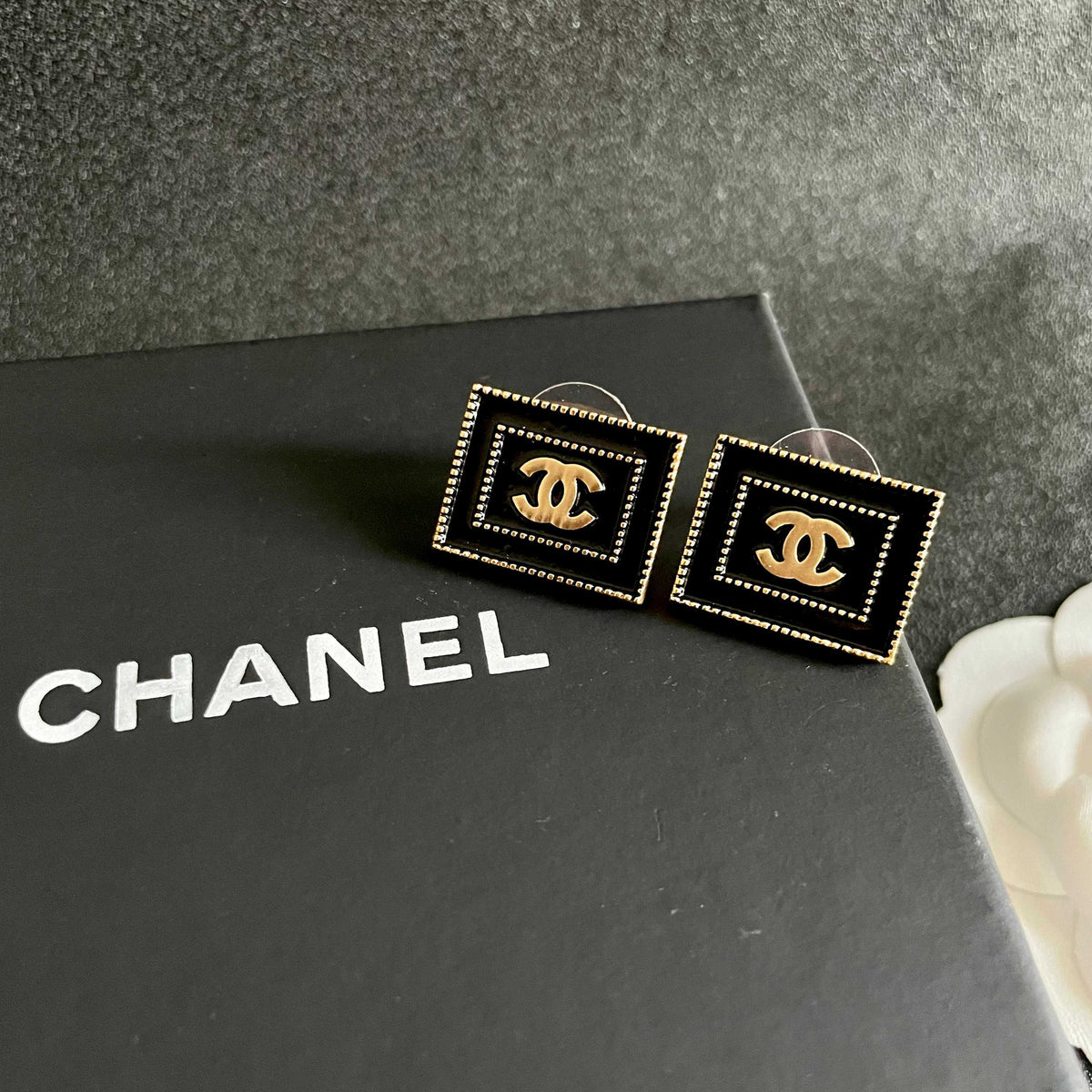Martin Graham stud earrings in polished metal-tone – detail view
