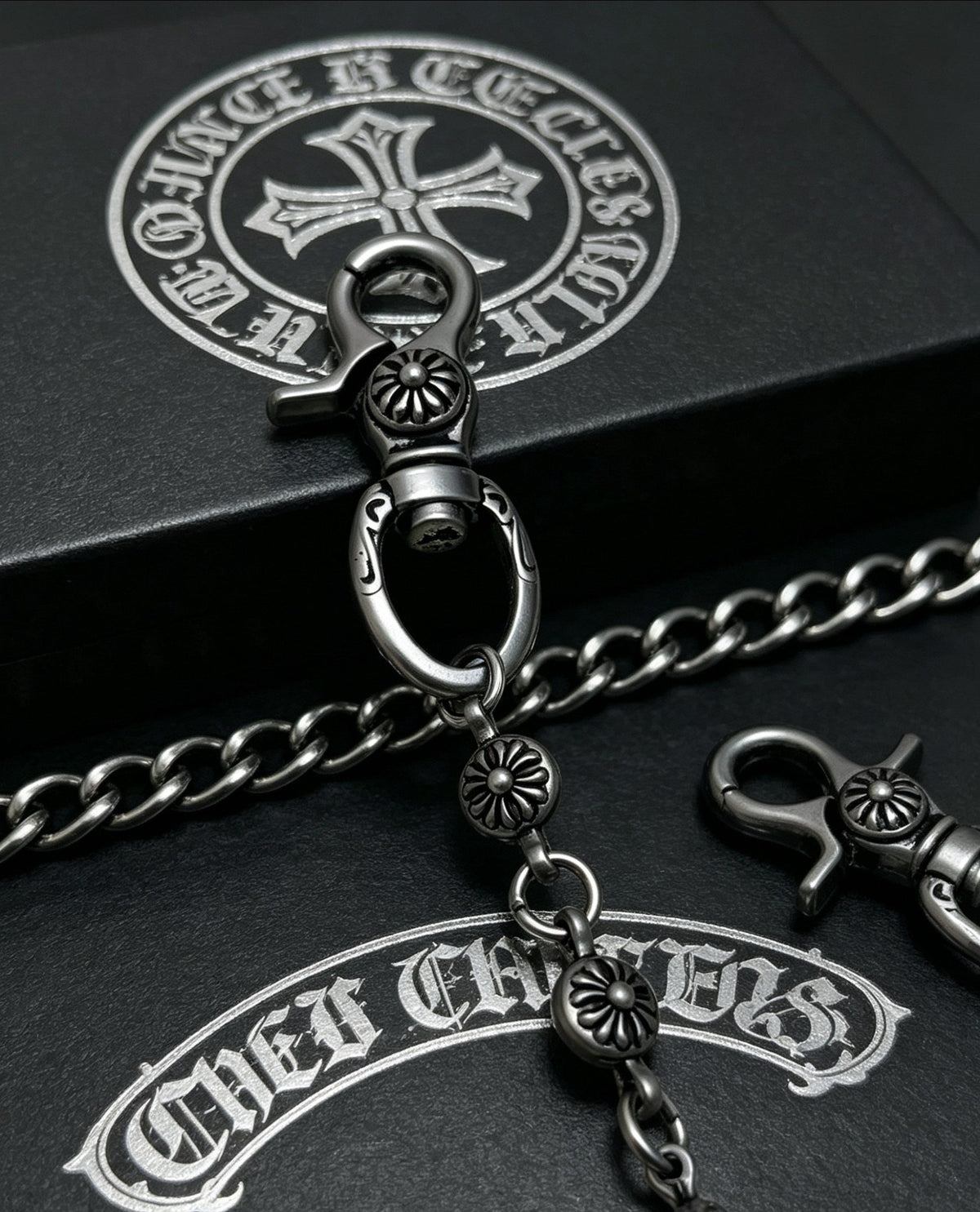 Martin Graham chain accessory in polished metal-tone – close-up detail