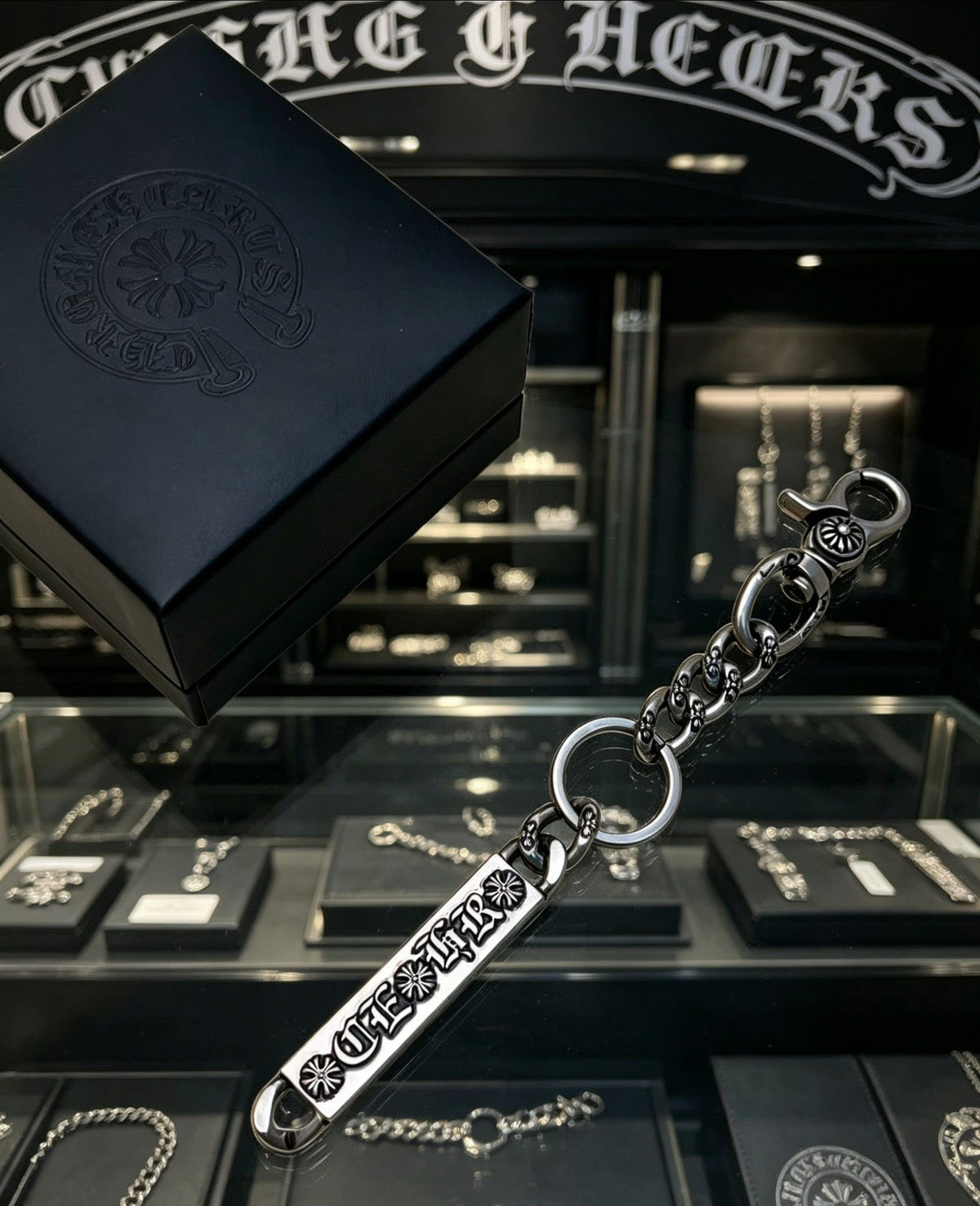 Martin Graham chain accessory in polished metal-tone – close-up detail