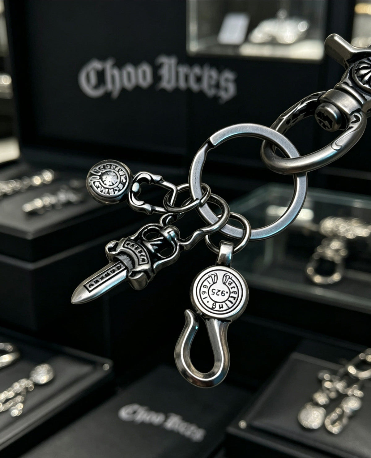 Martin Graham chain accessory in polished metal-tone – close-up detail