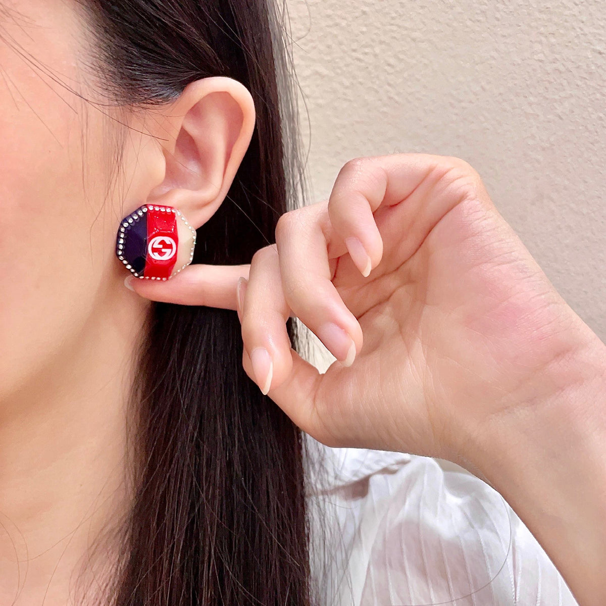 Martin Graham stud earrings in polished metal-tone – front product view
