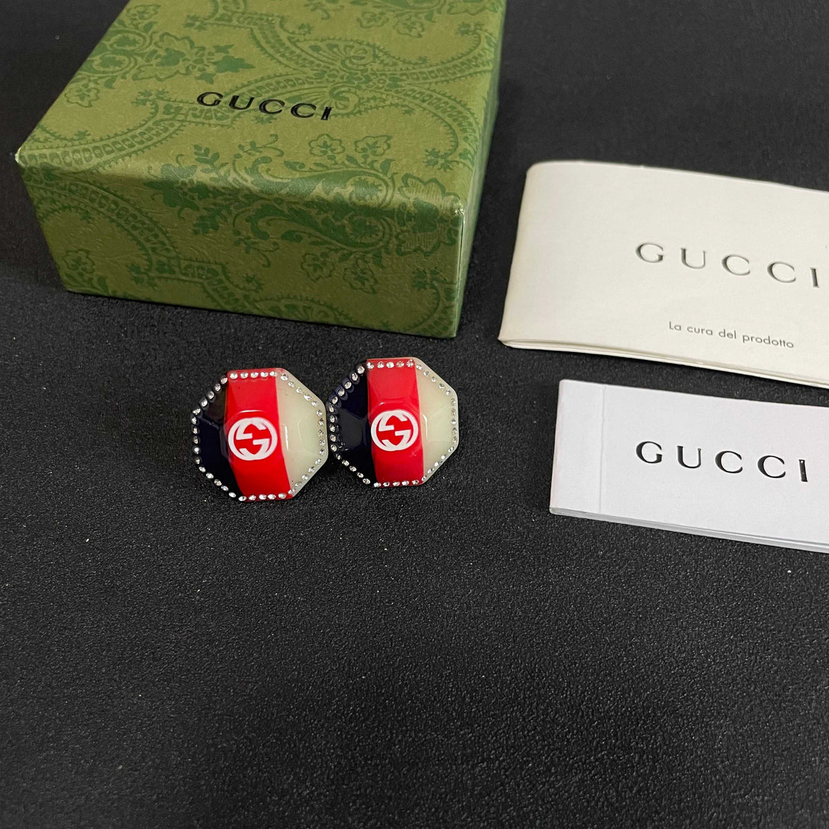 Martin Graham stud earrings in polished metal-tone – close-up detail