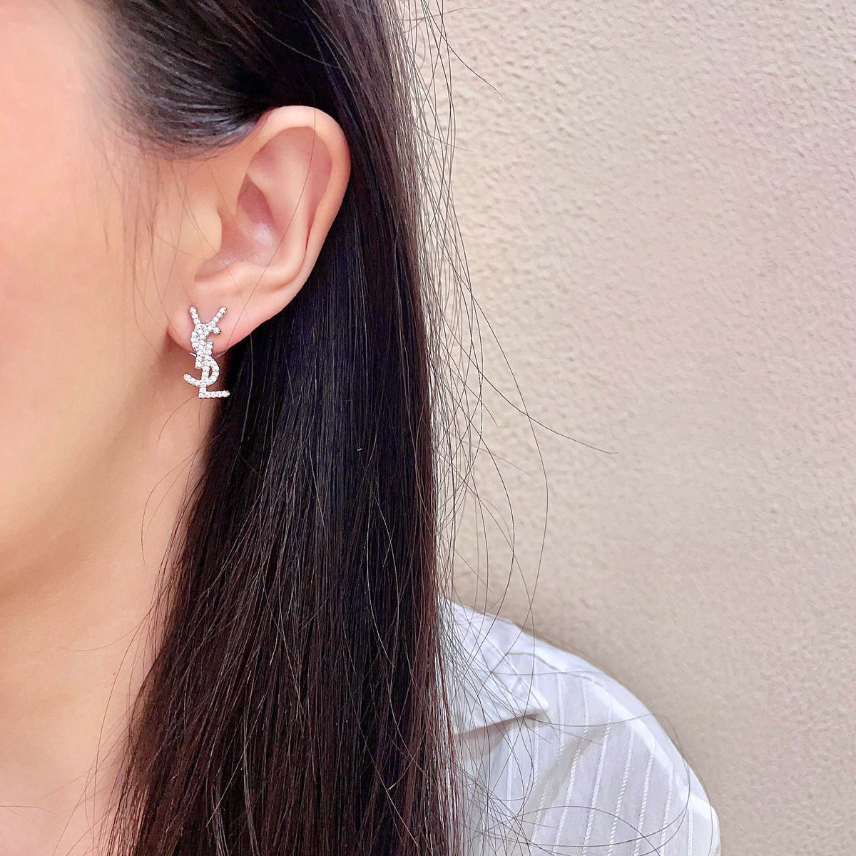 Martin Graham stud earrings in polished metal-tone – detail view