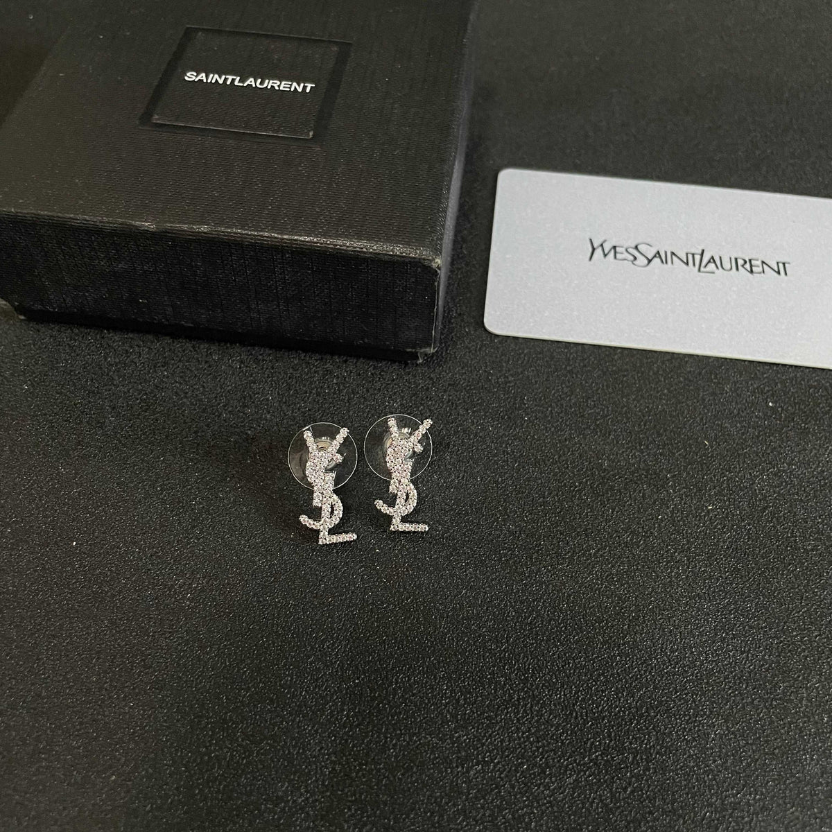 Martin Graham stud earrings in polished metal-tone – side detail