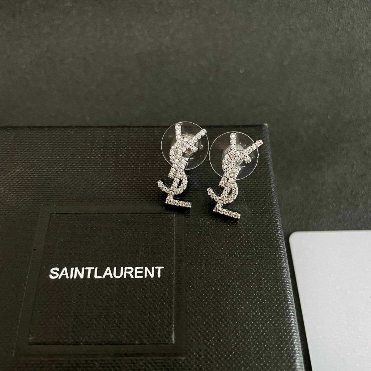 Martin Graham stud earrings in polished metal-tone – front product view