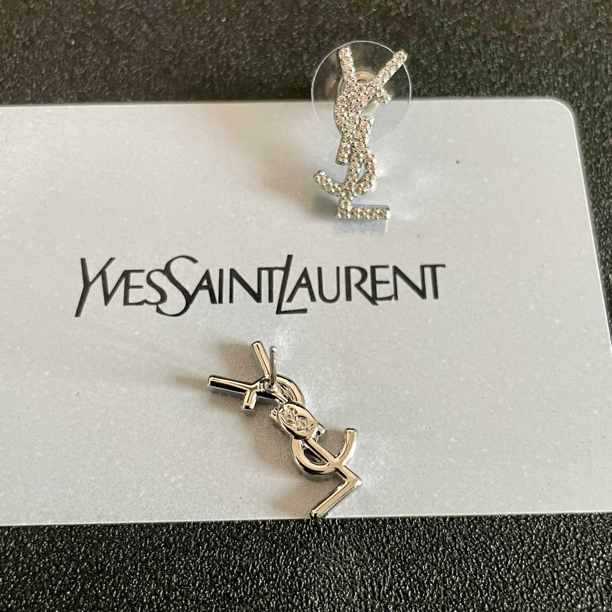 Martin Graham stud earrings in polished metal-tone – styled product view