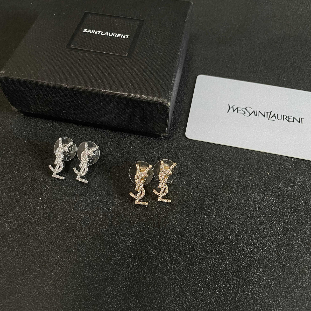 Martin Graham stud earrings in polished metal-tone – close-up detail