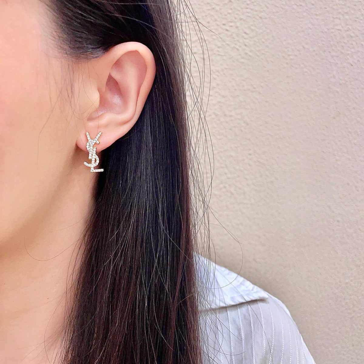 Martin Graham stud earrings in polished metal-tone – detail view