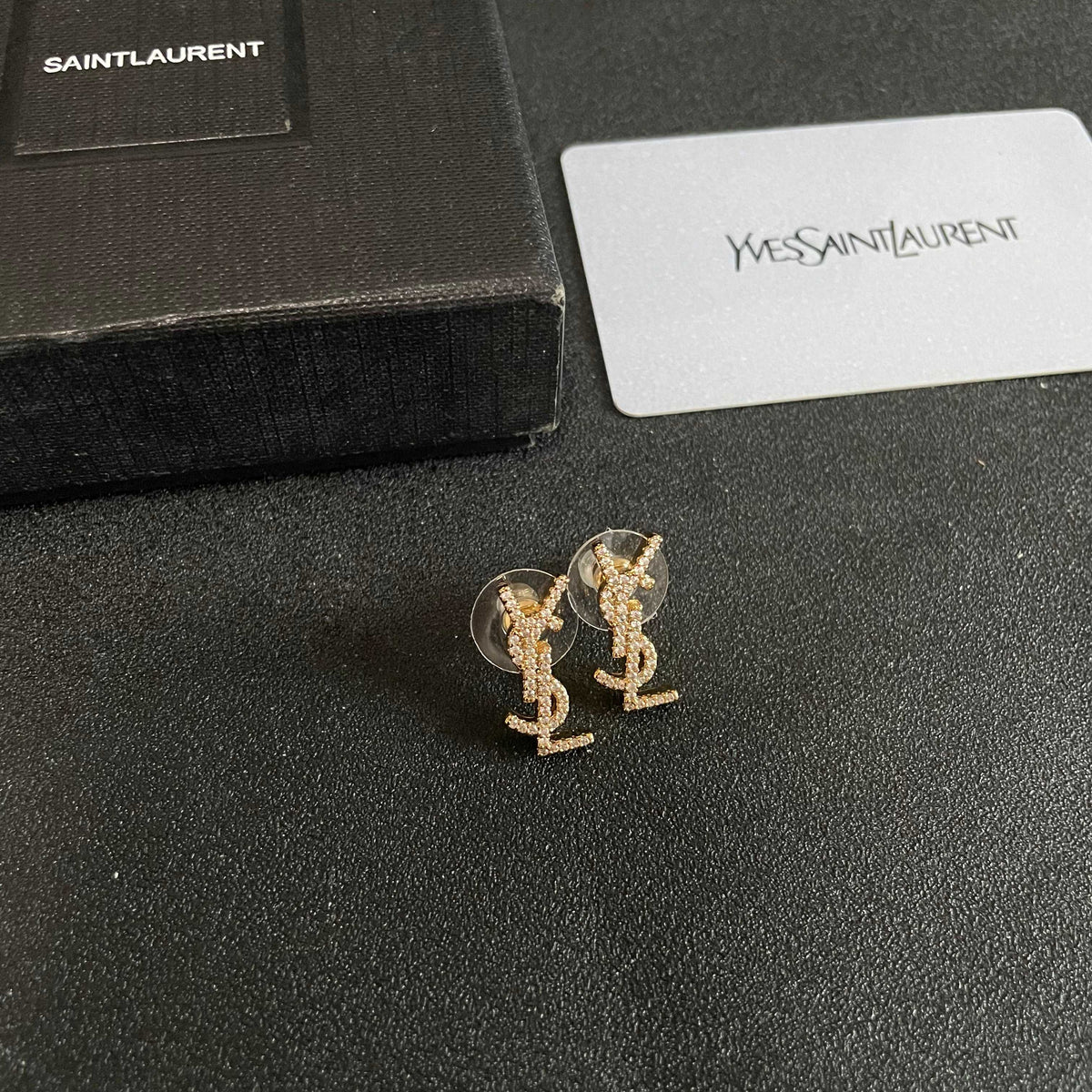 Martin Graham stud earrings in polished metal-tone – styled product view