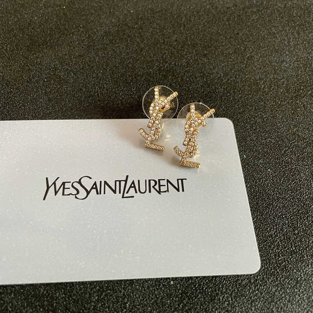 Martin Graham stud earrings in polished metal-tone – front product view