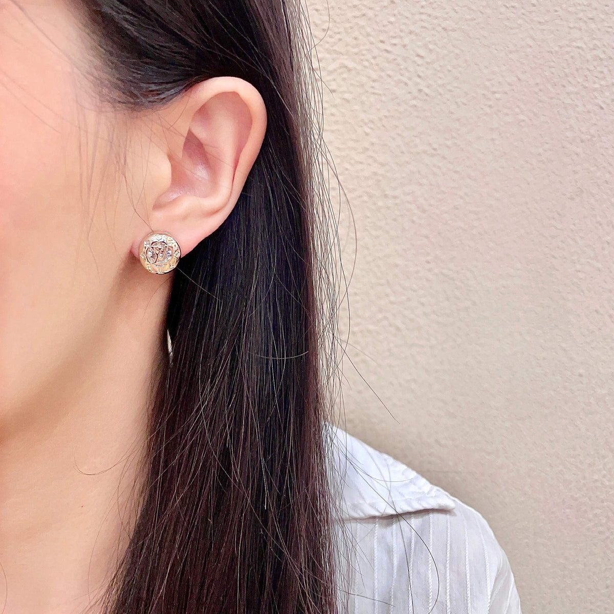Martin Graham stud earrings in polished metal-tone – detail view