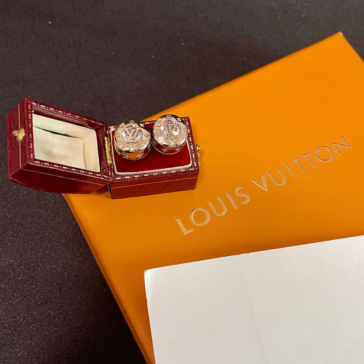 Martin Graham stud earrings in polished metal-tone – styled product view