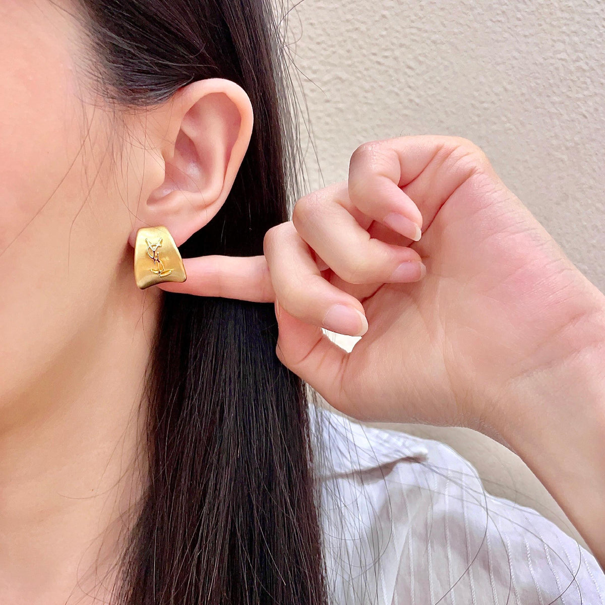 Martin Graham stud earrings in polished metal-tone – front product view