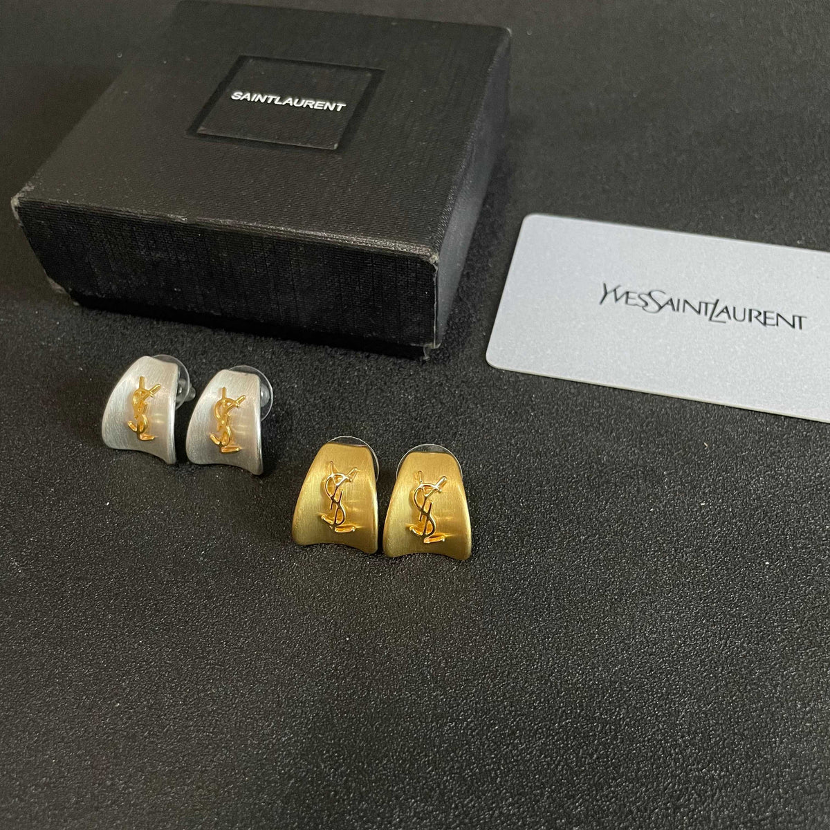 Martin Graham stud earrings in polished metal-tone – close-up detail