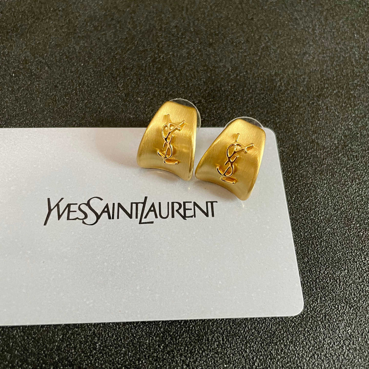 Martin Graham stud earrings in polished metal-tone – front product view