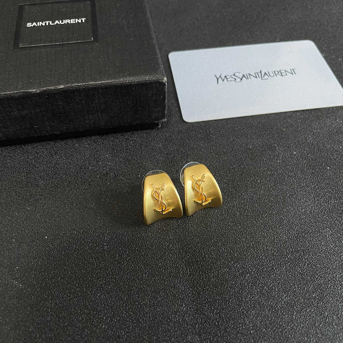 Martin Graham stud earrings in polished metal-tone – styled product view