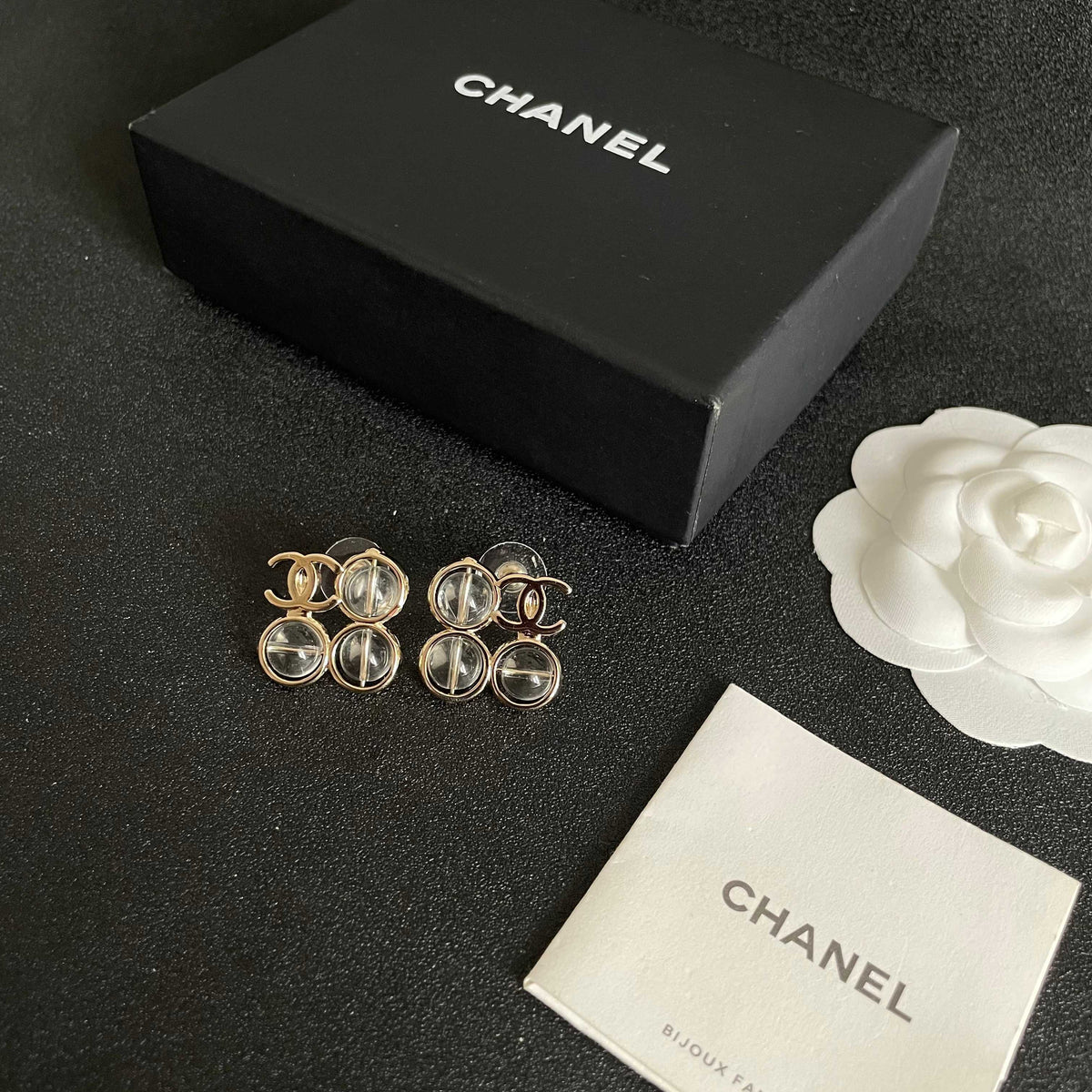 Martin Graham stud earrings in polished metal-tone – close-up detail