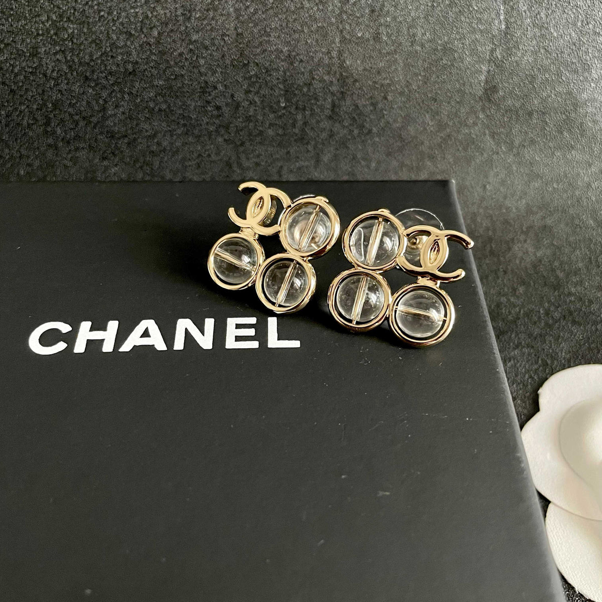 Martin Graham stud earrings in polished metal-tone – detail view