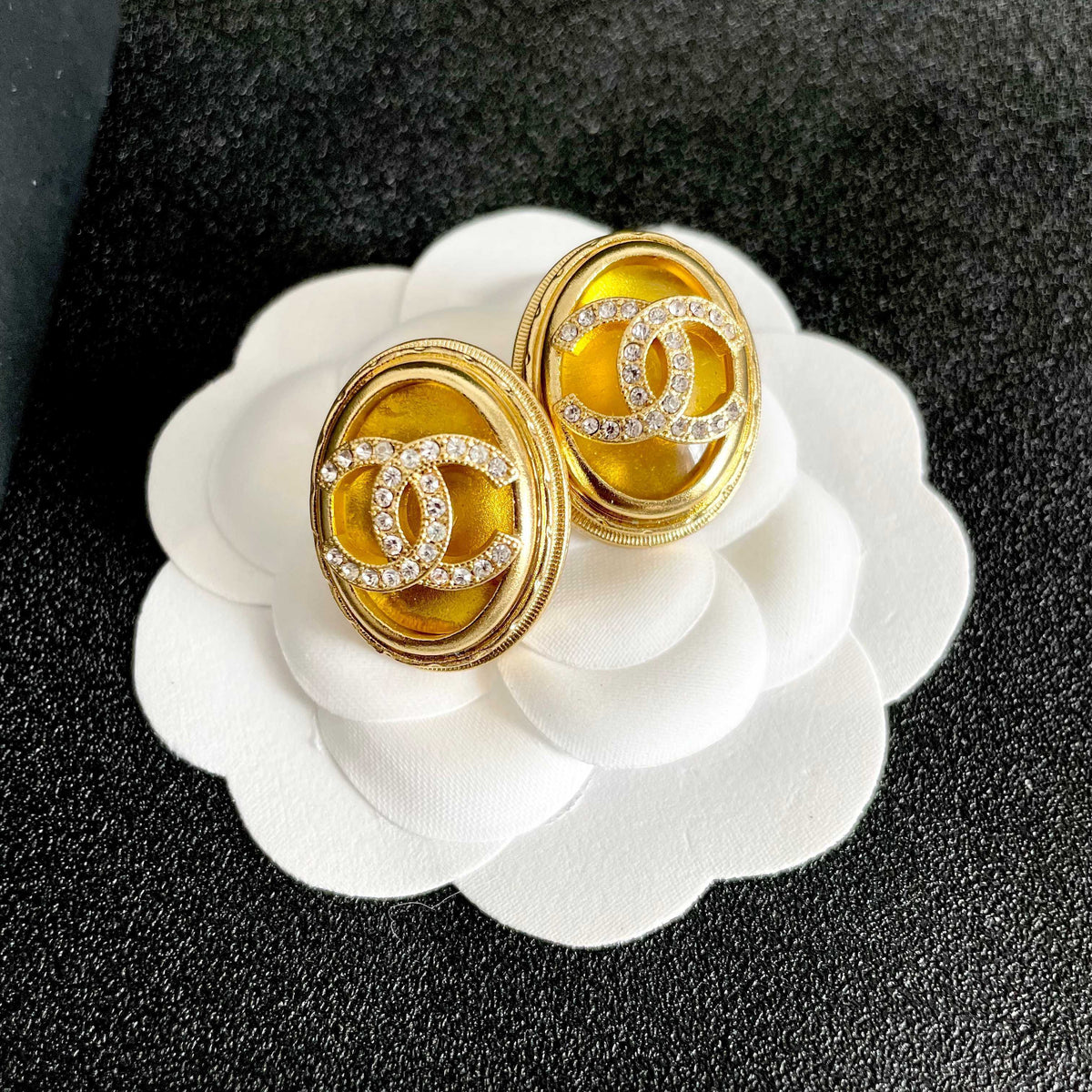 Martin Graham stud earrings in polished metal-tone – front product view