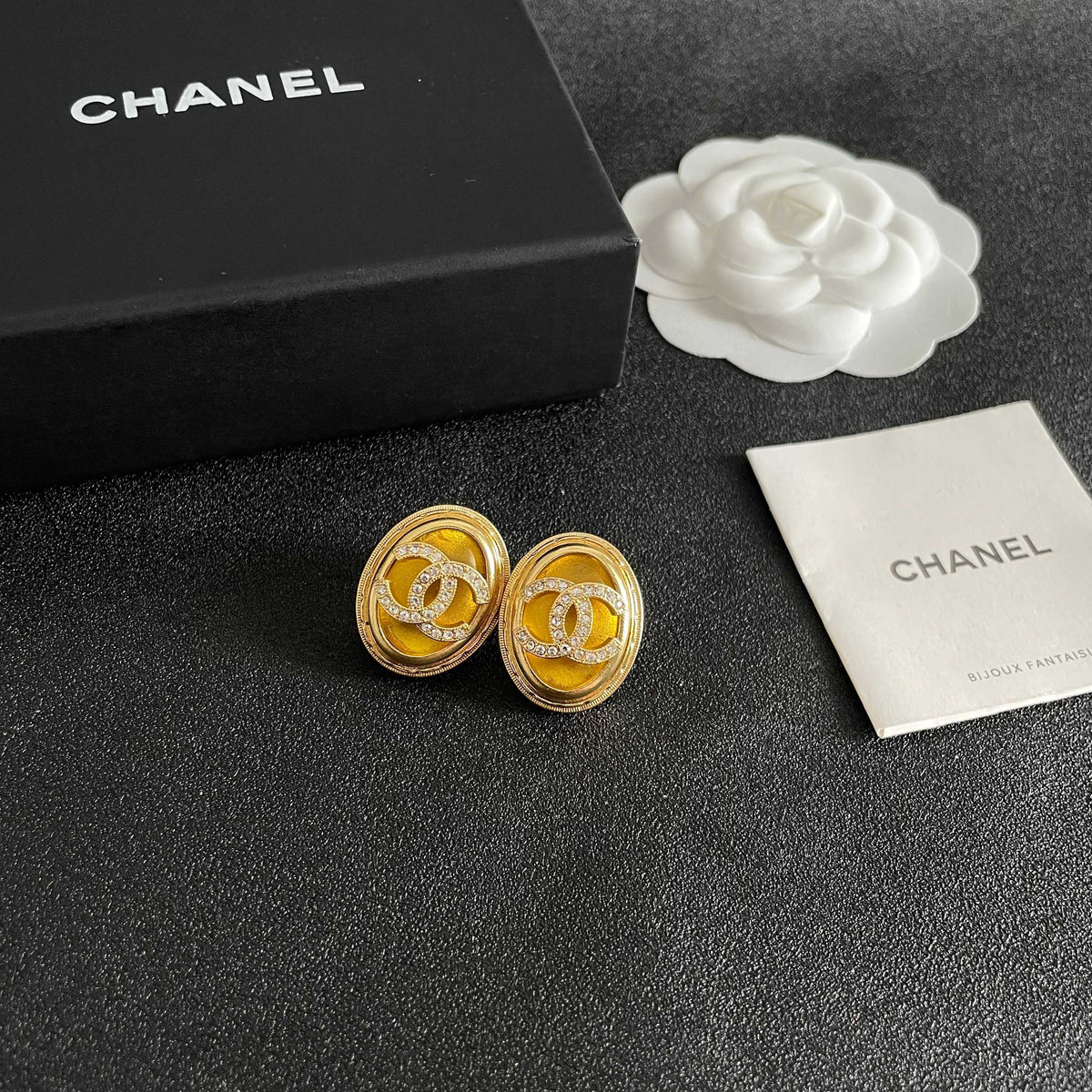 Martin Graham stud earrings in polished metal-tone – styled product view