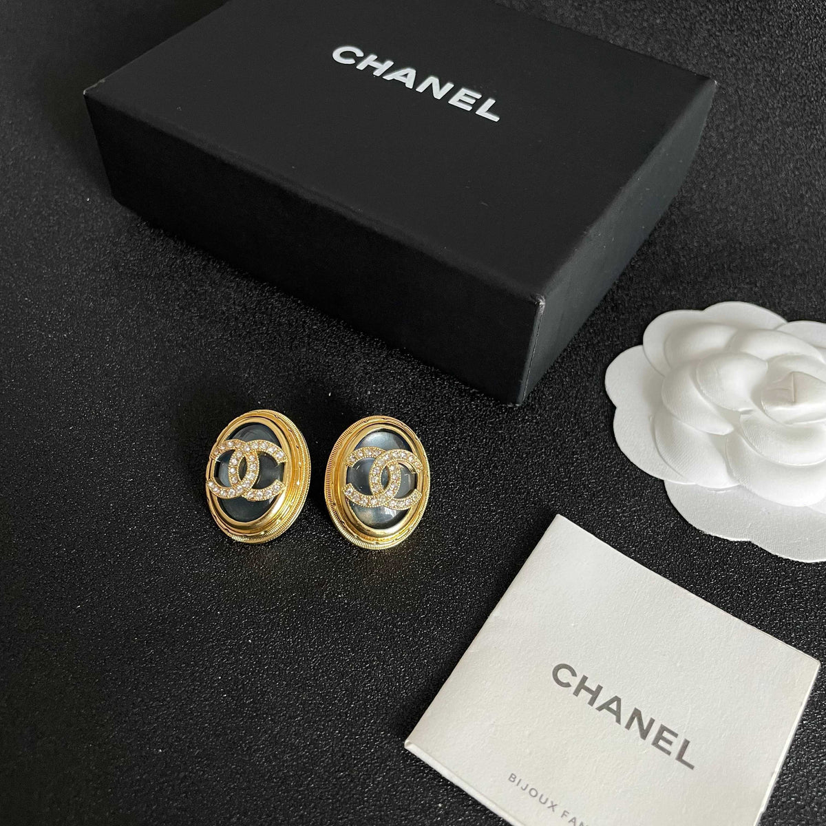 Martin Graham stud earrings in polished metal-tone – close-up detail