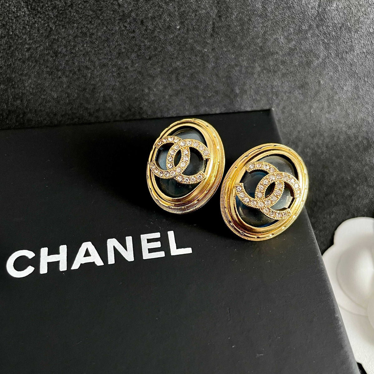 Martin Graham stud earrings in polished metal-tone – detail view