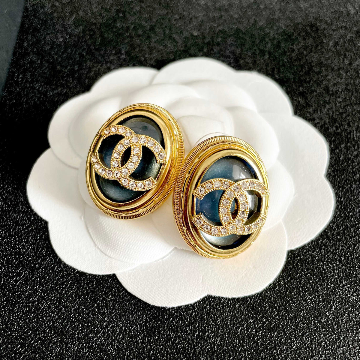 Martin Graham stud earrings in polished metal-tone – front product view