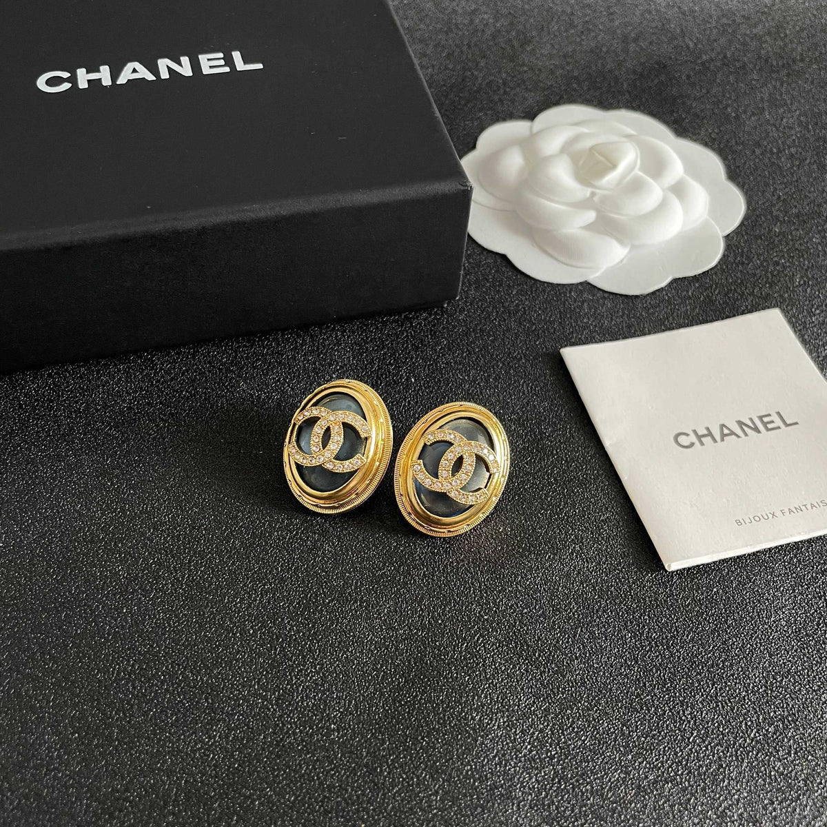 Martin Graham stud earrings in polished metal-tone – styled product view