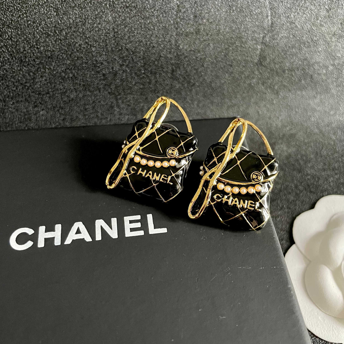 Martin Graham stud earrings in polished metal-tone – detail view