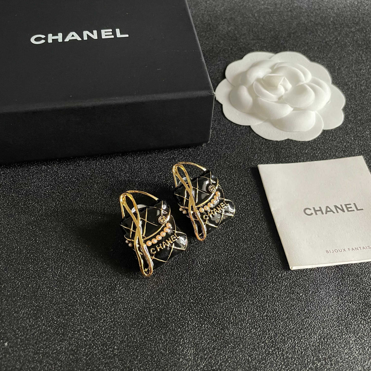 Martin Graham stud earrings in polished metal-tone – styled product view