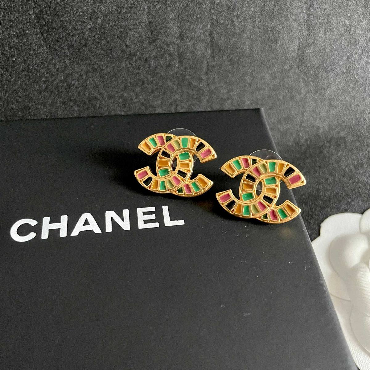 Martin Graham stud earrings in polished metal-tone – detail view