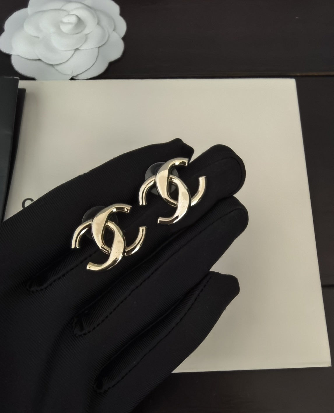 Martin Graham stud earrings in polished metal-tone – detail view