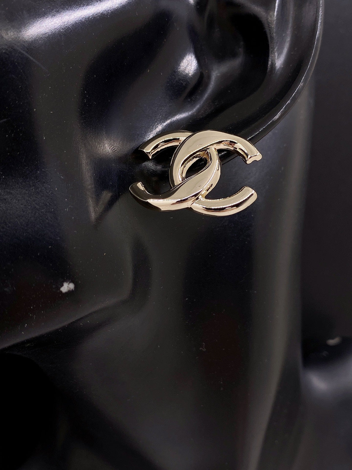 Martin Graham stud earrings in polished metal-tone – front product view