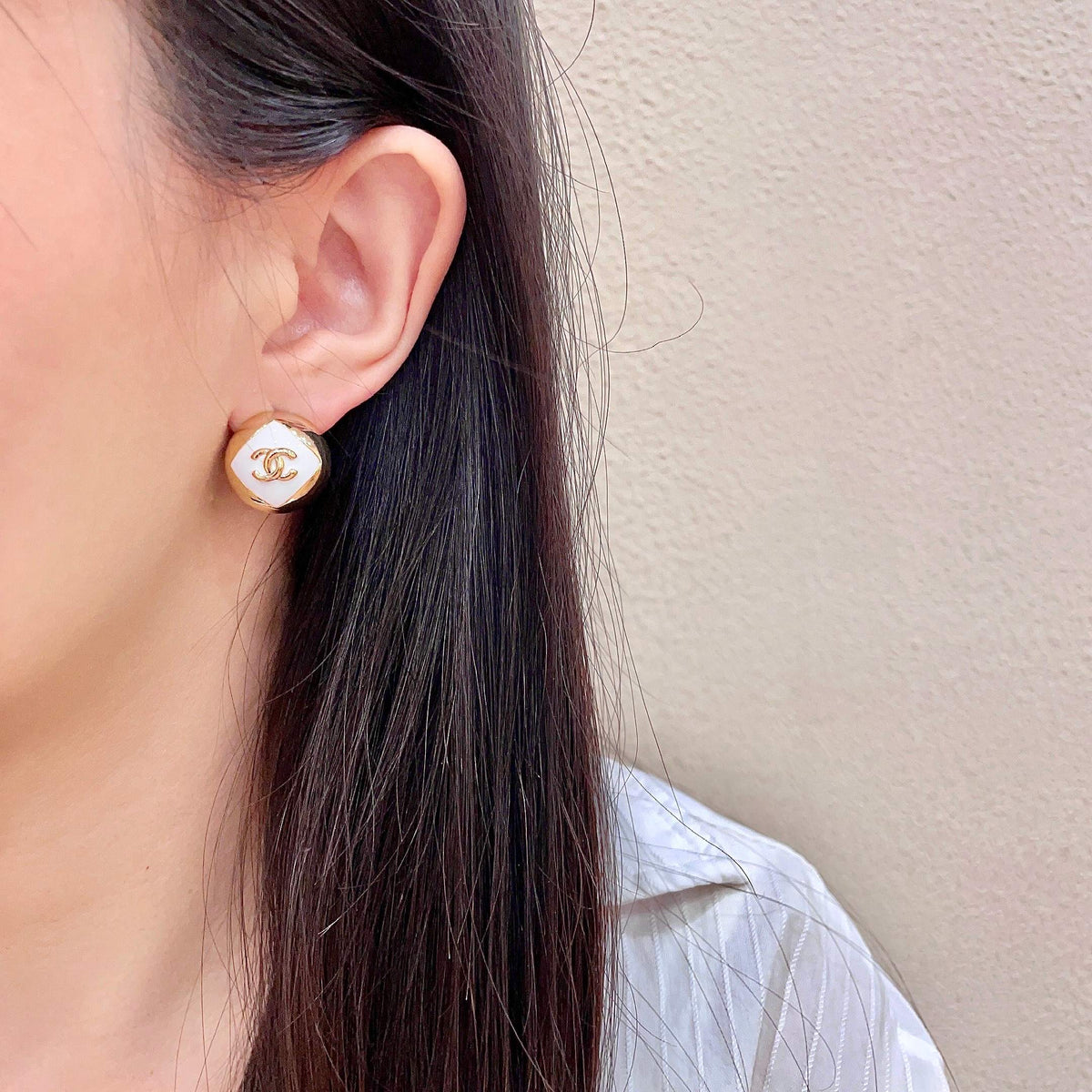 Martin Graham stud earrings in polished metal-tone – detail view