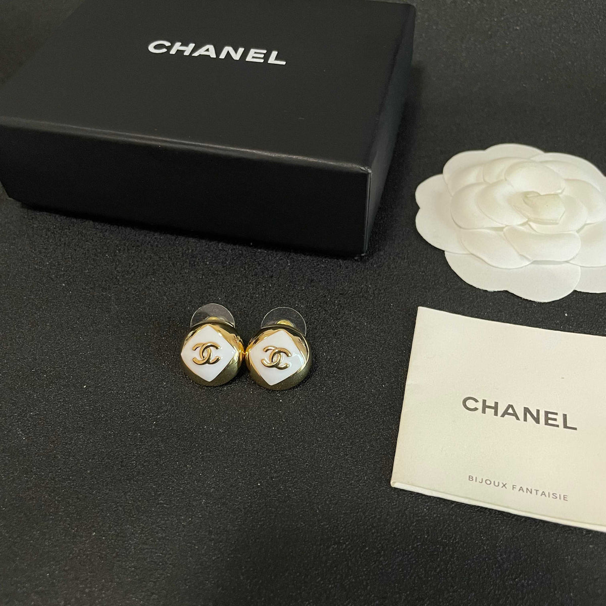 Martin Graham stud earrings in polished metal-tone – close-up detail