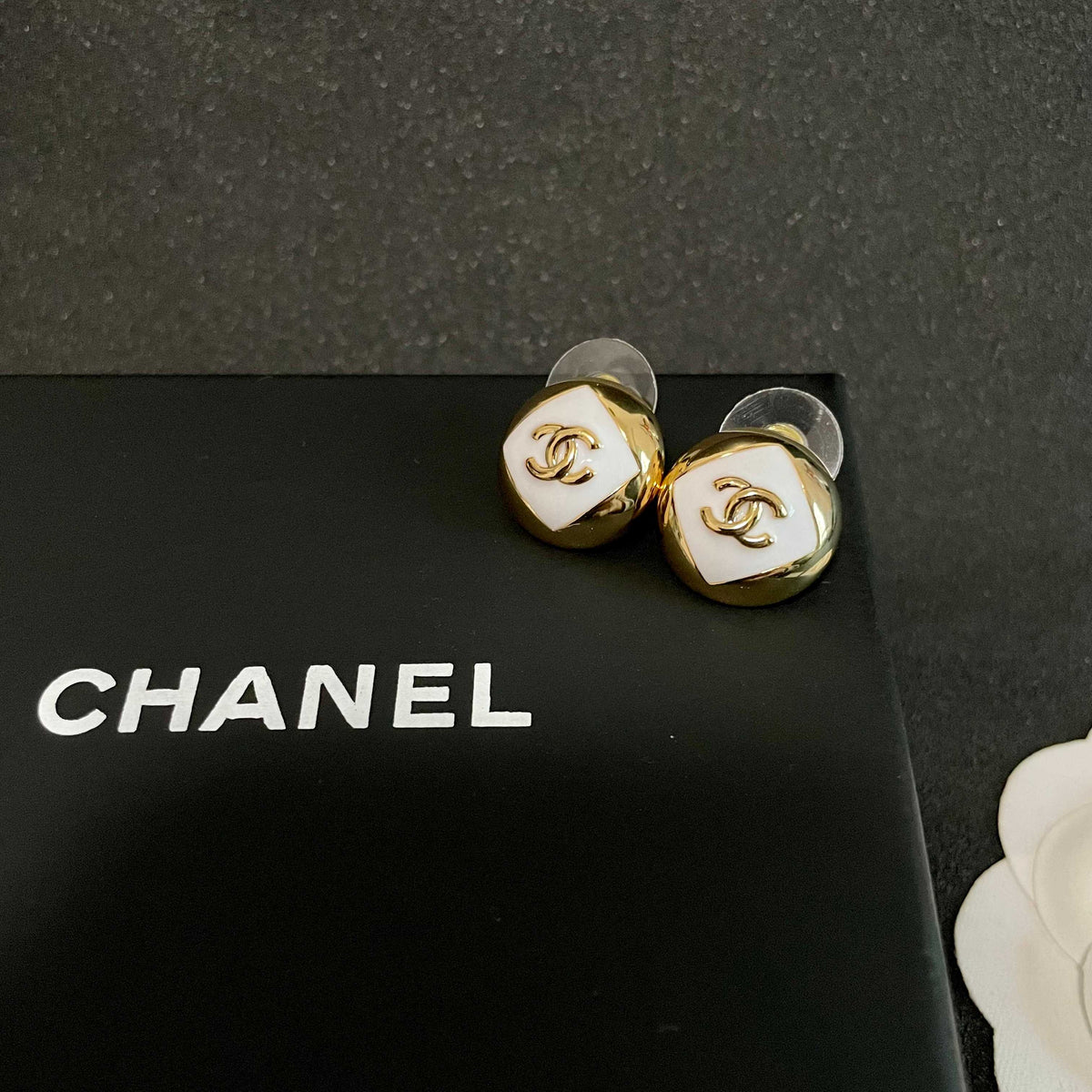 Martin Graham stud earrings in polished metal-tone – detail view